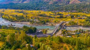 Scenic aerial view of the vibrant Ganderbal Valley and Wayil Bridge in Kashmir.